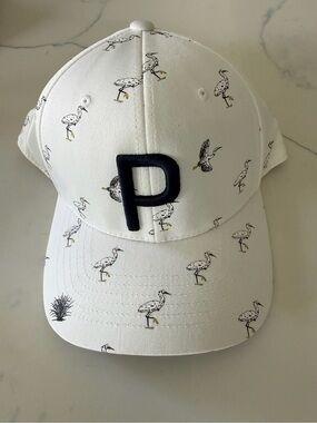 Puma White Cap with Navy P and Yellow-Accented Bird Print